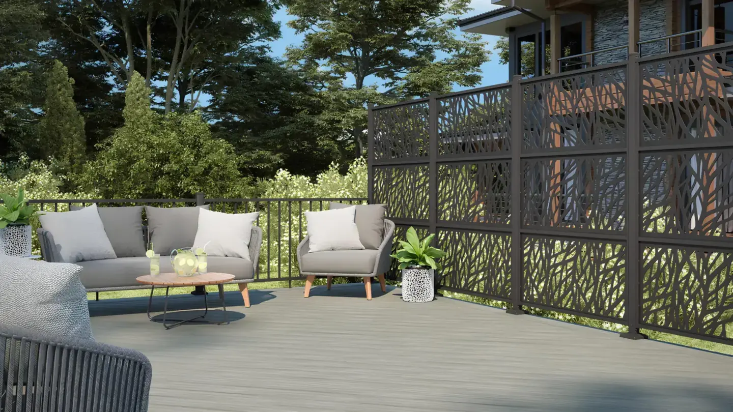pvc-custom-deck-with-wildwood-privacy-screen-and-outdoor-living-space-with-big-trees-and-house-on-the-background-in-tacoma-wa