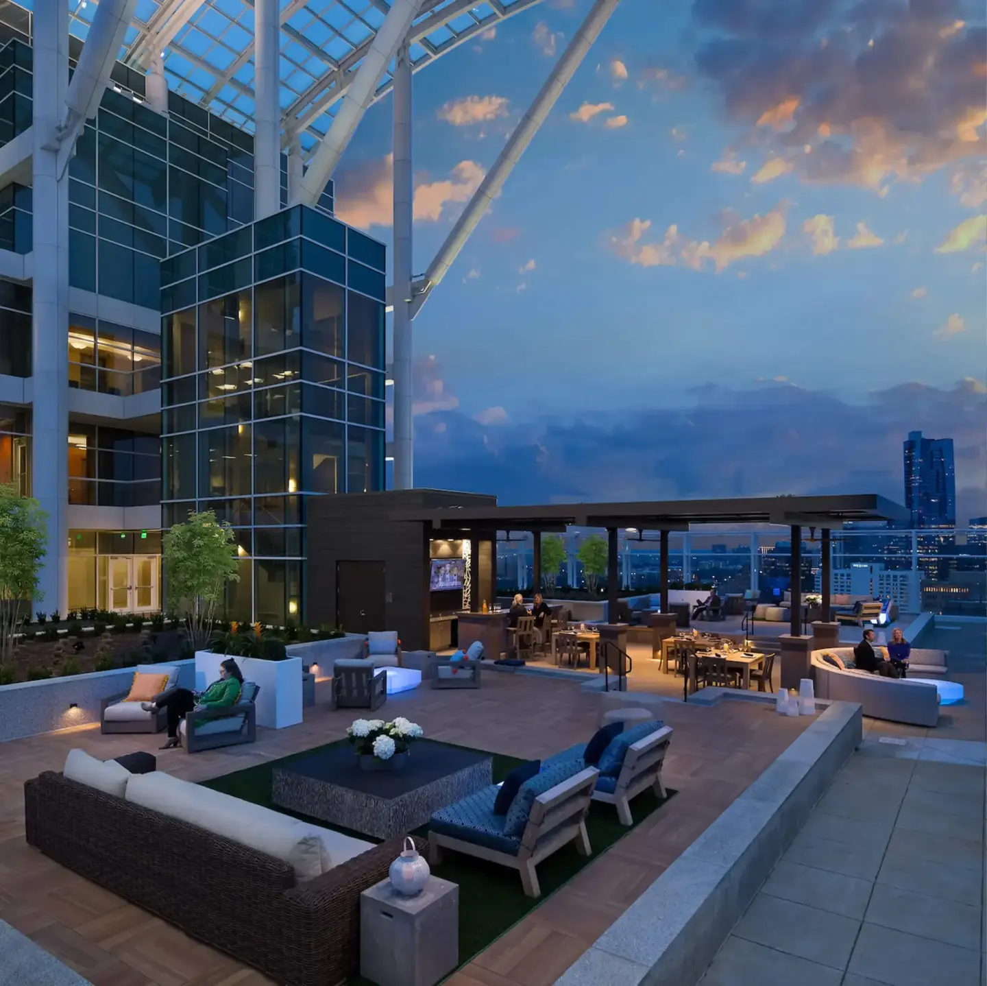 rooftop-custom-commercial-deck-with-outdoor-living-space-with-people-featuring-building-sky-and-city-view-on-the-background-in-tacoma-wa